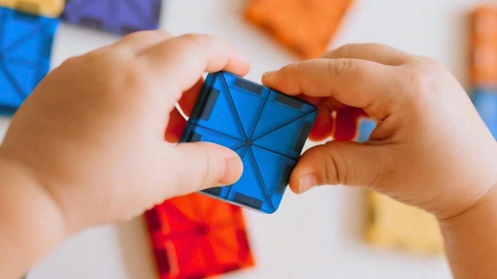 Baby-Playing-with-Magnetic-Tiles